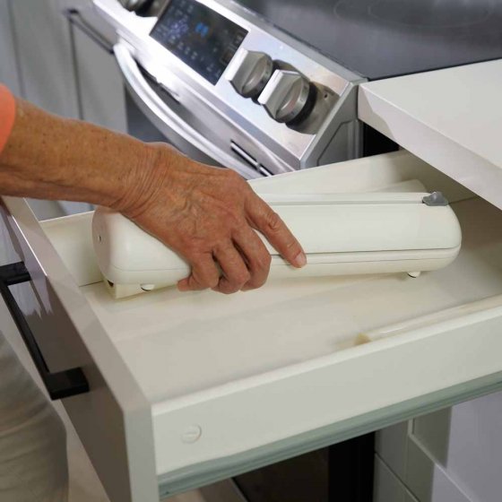 Machine de mise sous vide avec couteau intégré 